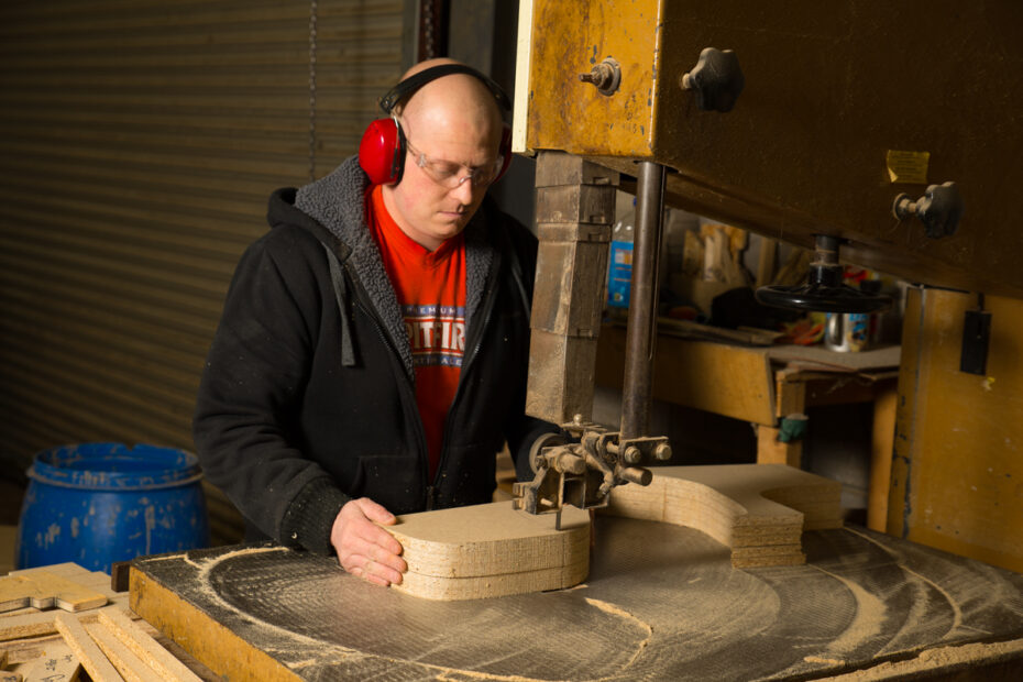 man working on a band saw