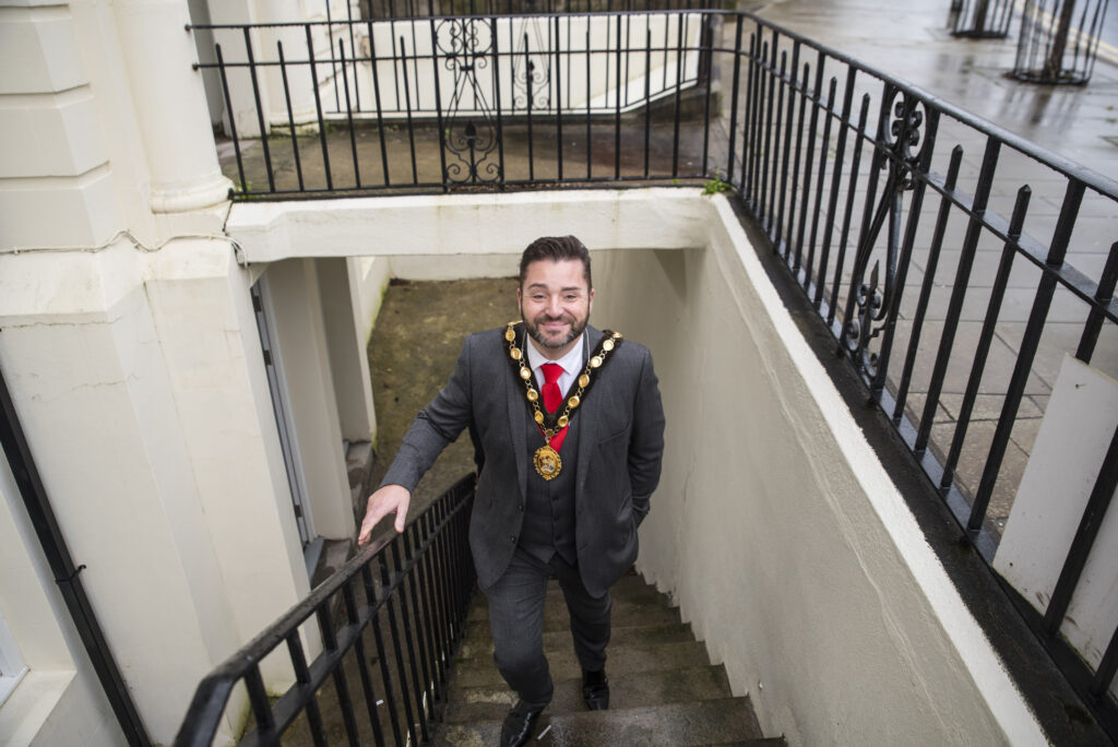 mayor stuart baldwin waling up steps