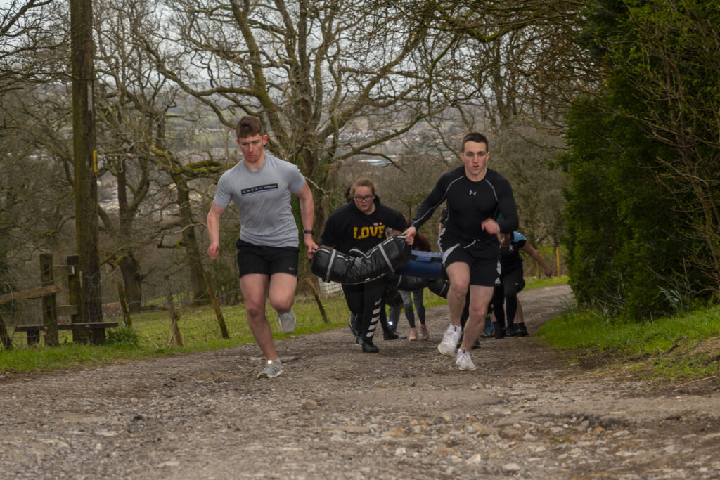 boys running up a hill